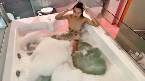 Nude petite Latina coed Noah Pells in bubbly Jacuzzi bath