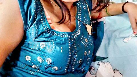 Desi aunty in low-cut blue embroidered top showing deep cleavage