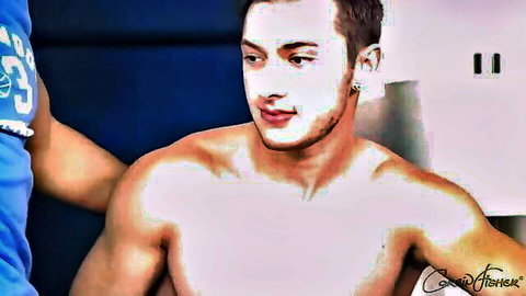 Muscular shirtless gay stud hugged intimately by hunk in blue basketball jersey