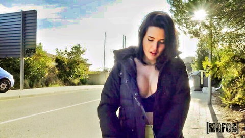 Serenia Keer teases with deep cleavage in open jacket outdoors on sunny roadside