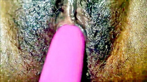 Close-up of thick pink dildo deeply penetrating hairy wet South Asian pussy