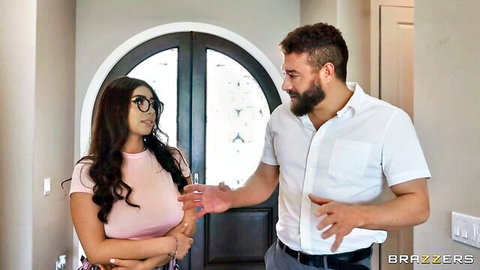Sultry MILF Angela in pink top flirts with bearded man in white shirt, Brazzers scene