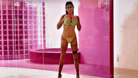 Danae Mari in skimpy green bikini, teasing with big tits