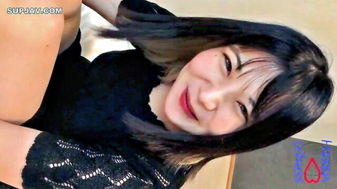 Smiling Asian amateur nursery teacher in black lace top close-up