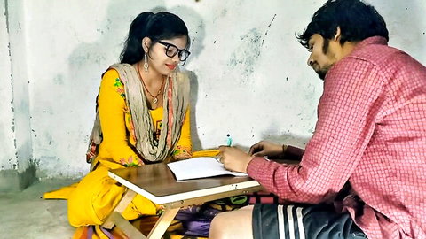 Indian tuition teacher and student in intimate study session
