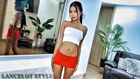 Belinda Pink Asian petite in white tube top and red mini skirt posing seductively
