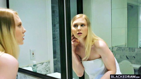 Blonde models Lily Rader and Arya Fae in towels, shocked mirror gaze