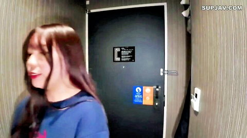 20s married Asian woman with long brown hair, fair skin in blue top hallway tease