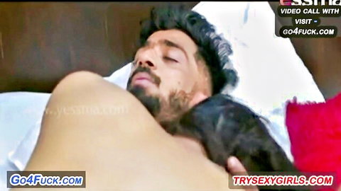 Tantalizing Indian MILF embracing shirtless man in passionate bed cuddle