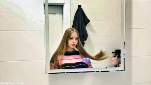 Yuiwoo in pink striped top flipping long blonde hair in mirror