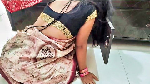 Sexy 28-year-old Indian MILF in saree bent over teasing her curves