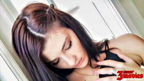 Jenna's seductive close-up with deep cleavage in black top, 3rd Degree adult film