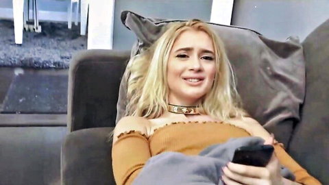 Anastasia Knight blonde teen in orange off-shoulder top smirking with phone