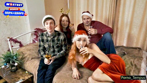 Amateur Christmas group with Santa outfits, redhead babe in red dress posing seductively