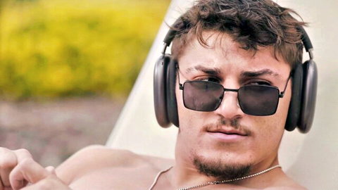 Khloe Kapri horny stepsister scene: handsome athletic man lounging shirtless in sunglasses and headphones