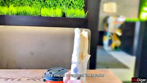 Babe teasing with juicy shawarma wrap, hinting at anal craving in adult scene