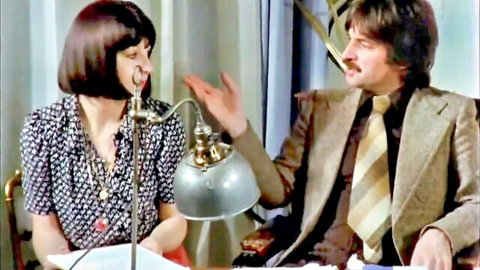 Retro French couple in vintage conversation, brunette woman in polka-dot dress