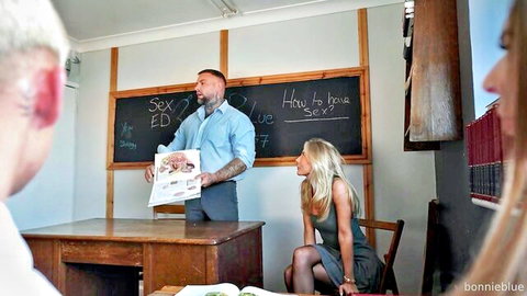 Bonnie Blue blonde model in sexy dress for classroom gangbang sex ed scene