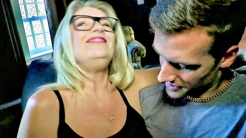 Blonde amateur wife smiling intimately with man kissing her neck