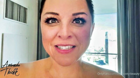 Smiling brunette mature beauty posing topless in sunny room for OnlyFans