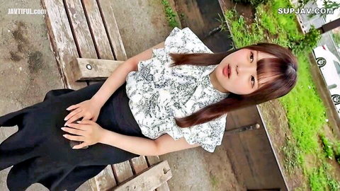 Cute Asian waitress in ruffled blouse spreads legs fingering pussy under skirt on outdoor bench