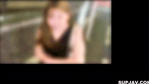 Fair teen with big tits showing deep cleavage in black top smiling seductively