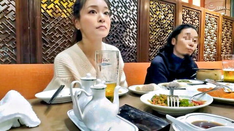 Two sexy Asian women with censored eyes dining intimately at restaurant table
