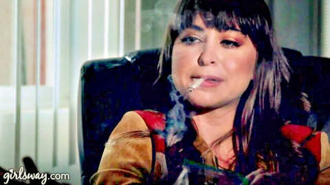 Riley Reid smoking dramatically in fringed jacket before lesbian fuck with Kenna James