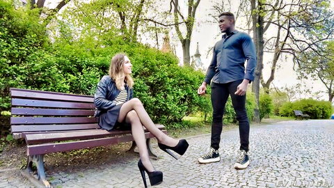 TS Emily Adaire teases black stud in park, high heels skirt