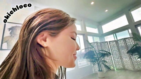 Okiichleo smiling side profile with long brown hair, Dredd OnlyFans teaser