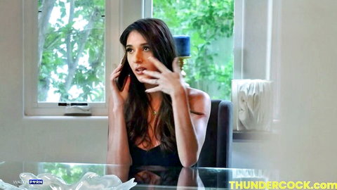 Aria Sloane in sexy black top, expressive face during hot call
