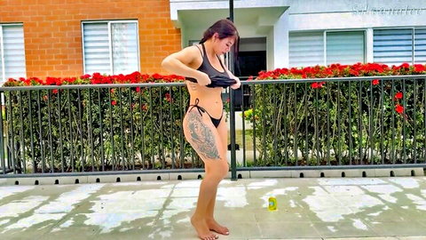 Silvana Lee teasing in black bikini outdoors, curvy Latina with tattoos