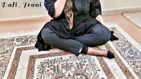 Dafi Irani, curvy Iranian beauty in black abaya and stockings, sitting elegantly