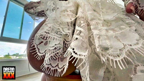 Busty woman's massive dark tits spilling out of sheer white lace lingerie