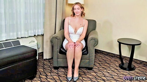 19yo Bella in low-cut white lace dress, smiling seductively