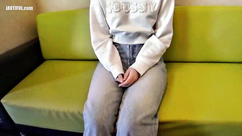 Young Asian woman in white hoodie and gray jeans sitting casually, FC2 creampie preview
