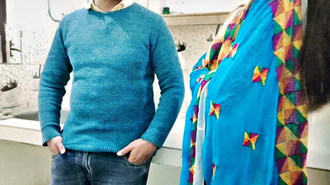 Desi bhabhi in colorful saree teases with man in blue sweater