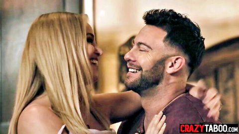 Blonde beauty embraces smiling bearded man in intimate couple moment