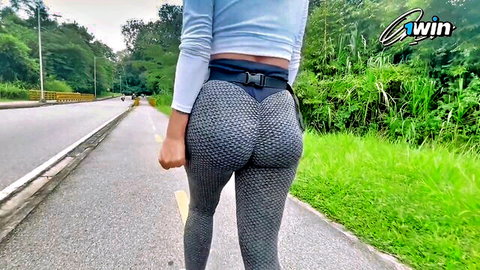 Jenifer Have Fun walking in tight gray leggings, teasing big round ass outdoors