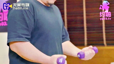 Man lifting purple dumbbells in gym with female coach silhouette, real sex tease