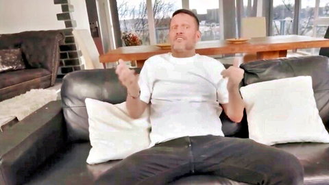 Clothed man in white t-shirt gesturing surprised on couch, anal won't fit theme