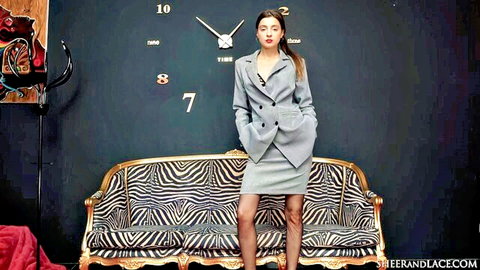 Melena Maria Rya posing in sexy gray suit and skirt