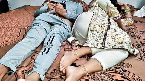 Sexy Indian woman lies on bed with salwar pants pulled down exposing bare juicy ass cheeks and anklets next to man on phone
