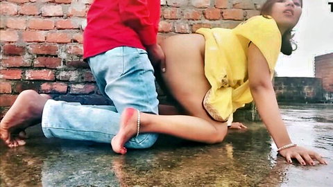 Mamta bent over in yellow dress, railed doggy style by Mahesh on wet roof