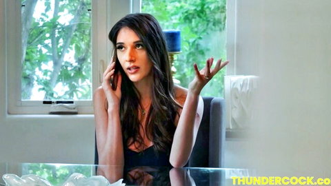 Sexy brunette with small tits and cleavage talks on phone gesturing excitedly