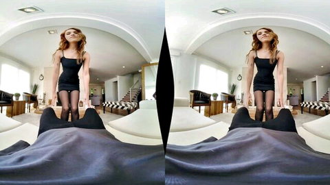 Redhead babe in black mini dress and stockings stands over guy POV fisheye VR tease