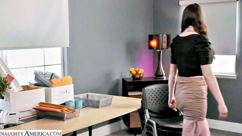Alyx Star teasing in short skirt and black top, naughty office vibe