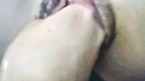 Close-up of woman's pussy being fisted intensely by partner
