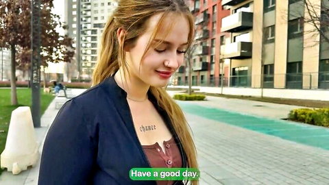 Blonde student girl with nose piercing and chest tattoo in urban outdoor setting