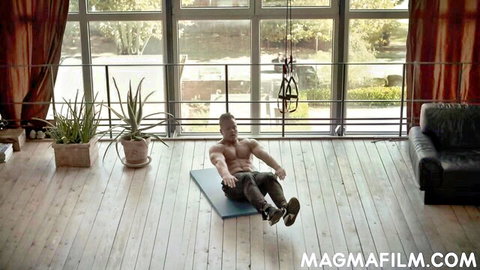 Muscular bald black man doing yoga sit-ups in pants, MagmaFilm solo